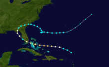 The path of a storm that begins well to the east of the Florida peninsula, and after moving westward and striking Florida, it curves northeast and re-enters the Atlantic Ocean.