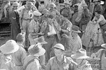 Soldiers disembarking from a ship