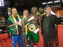 New IBO International middleweight champion Osumanu Adama (center) with his manager Wasfi Tolaymat in the ring at UIC Pavilion in Chicago, December 2010