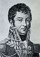 Black and white print shows a young man dressed in a high-collared, dark military coat trimmed with braid.