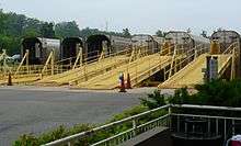 Autoracks lined up at their loading ramps at the Lorton station.