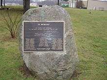 brass plaque listing the people's names who died during the disaster (with the exception of the Kehoes, fixed to a large  boulder