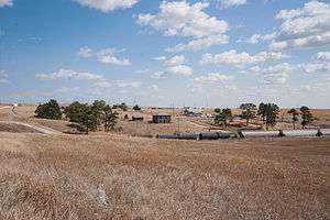 A photo of the remainder of Belmont, looking east from across the railroad tracks.