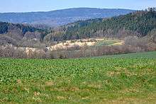 Distant view of quarry, with hills in background