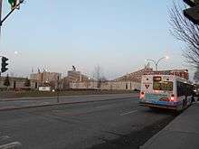 An STM bus waits outside the Assomption metro station