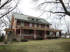 Photograph of Broadview Mansion, a two-and-a-half story, brick house with a broad veranda