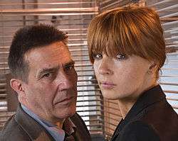 Ciarán Hinds as James Langton and Kelly Reilly as Anna Travis in Above Suspicion.