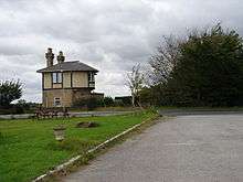 strange double story building with overhanging upper storey