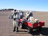 Nell Beedle, Emily MacDonald and Frank Eckardt of Crew 7 use a reflectance spectrometer during EVA on July 19, 2002.