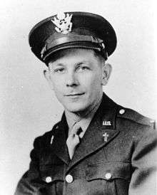 A young looking man in military uniform with crosses on his lapels