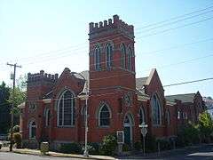 Photograph of a church on an urban street corner