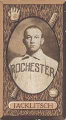 A sepia-toned image of a man in a white baseball uniform with "Rochester" across the chest in dark block print