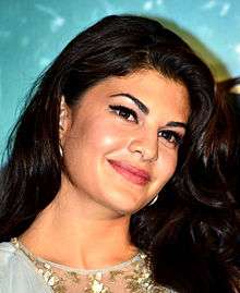 Jacqueline Fernandez is smiling gently.