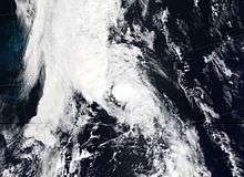 Satellite imagery of a disorganized tropical storm undergoing an extratropical transition.
