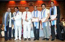 Govinda with five other men onstage