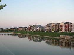 some houses of the New Town area, and their reflections in a lake