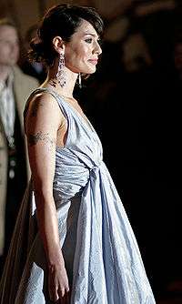 Actress Lena Headey facing right in a silver dress at the London premiere of the film in March 2007