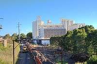 Future site of the Lewisham West light rail station showing the Mungo Scott flour mill on the right and industrial buildings on the left