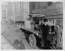 Bates shaking hands with New York Secretary of State Francis Hugo, January 1920.