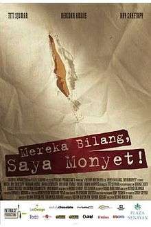 A poster, showing an elongated tear. The words "Mereka Bilang, Saya Monyet!" are stenciled below.