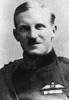 Portrait of moustachioed man in military uniform with pilot's wings on chest