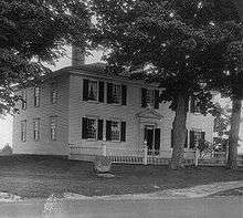 Photograph of a white house.