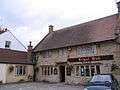 Stone building with sign saying The Royal Oak