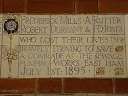 A tablet formed of five tiles of varying sizes, bordered by yellow and blue flowers in an art nouveau style