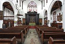 A church interior looking towards the altar and east window