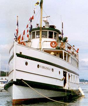 Port bow view of a steamer at her moorings.