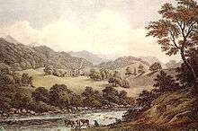 A wooded river valley surrounded by mountains, with a distant grand house and lawns on the far slope