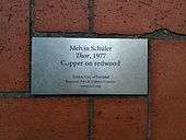 Metal plaque set in brick pavers