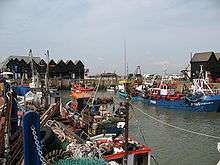 Several boats docked at a harbour